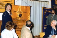 Dereck Stephenson presenting the Creed Banner to Club President Larry Gingerich (1984)